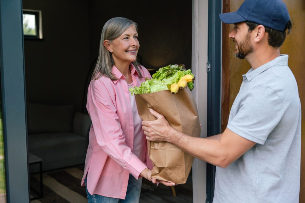 Woman gets grocery delivery at her door after ordering with SNAP card.