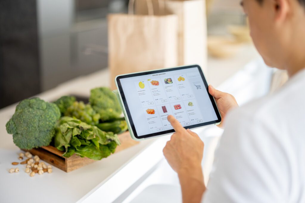 Man orders produce from subscription e-commerce food retailer using SNAP.